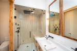 The master ensuite has custom tile & steam shower to refresh after a day of adventure.